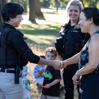 Commissioner Stegmann greets Department of Community Justice officers at the National Night Out.