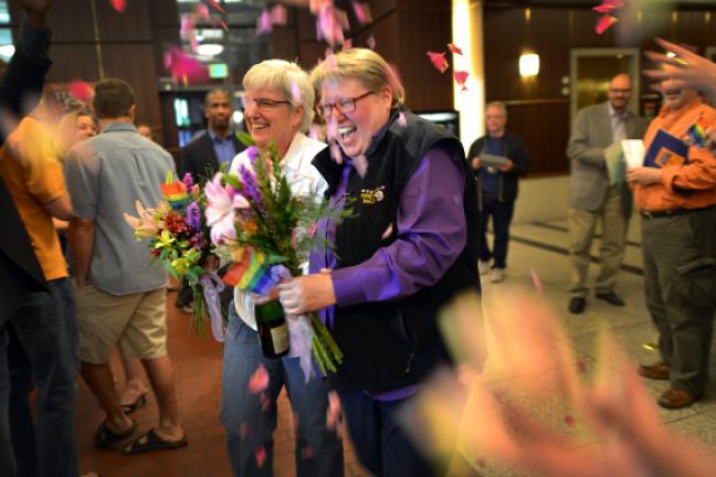 Deanna Geiger, left, and Janine Nelson in the lobby of the Multnomah Building after receiving their marriage license from Multnomah County. 