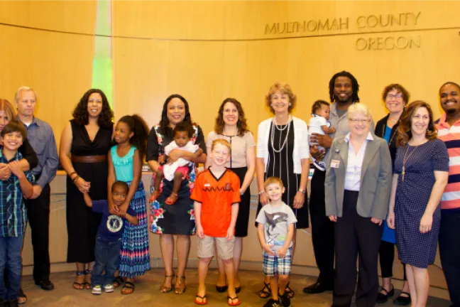 Group supporting breastfeeding poses for pictures
