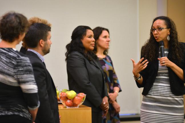 Program director Rachael Banks speaks at Monday's grant announcement celebration as Board of Commissioners look on> 