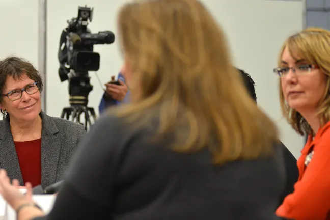 Commissioner Shiprack (left) and Congresswoman Gabby Giffords (right) listen intently as executive director of Americans for Responsible Solutions Hayley Zachary speaks at Tuesday’s roundtable.