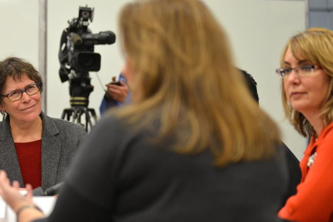 Commissioner Shiprack (left) and Congresswoman Gabby Giffords (right) listen intently as executive director of Americans for Responsible Solutions Hayley Zachary speaks at Tuesday’s roundtable. 