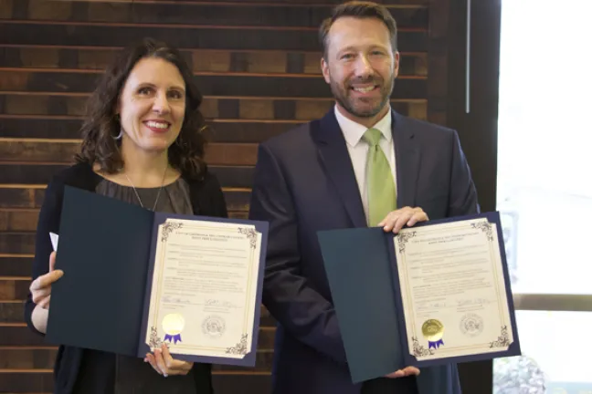 Chair Kafoury (left) and Mayor Bemis display certificates of their agreement to work together to pursue Promise Zone designation for the Rockwood Community.