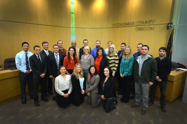 The Department of Community Justice's 22 newly sworn-in parole and probation officers.