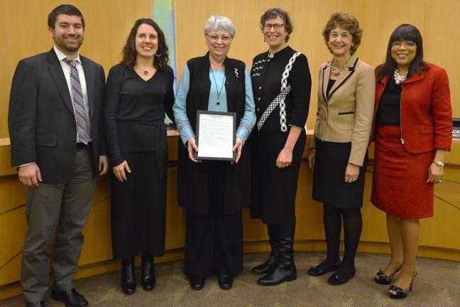 Kathleen Todd poses with the county commissioners