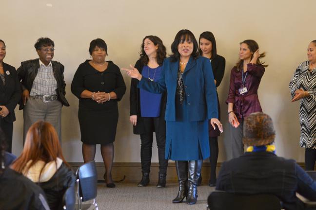 Foreground: Commissioner Smith Background, from left: Kimberly Howard; Kendall Clawson; Former State Senator Margaret Carter; Serena Stoudamire;  Marissa Madrigal; Grace Neal; Jessica Morkert-Shibley; Nicole Rose; and Judge Adrienne Nelson 