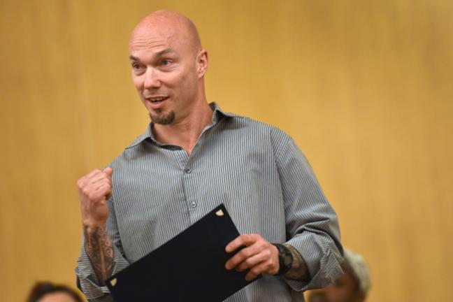  The Department of Community Justice client Carey Markwell pumps his fist in recognition of his accomplishments during his first 120 days in the Multnomah County Justice Reinvestment Program.