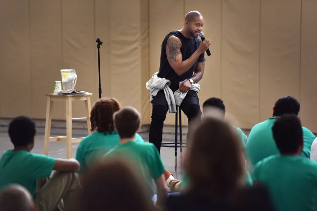 Author Mitchell S. Jackson displays Rose City-inspired tattoo to young people at the Donald E. Long Juvenile Detention Center on Tuesday.