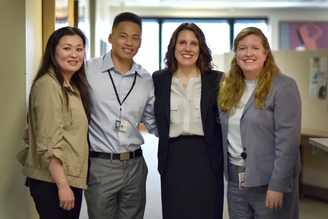 From left, Mai Trinh (mother), Sang Dao (son), Multnomah County Chair Deborah Kafoury and Juvenile Services Division director Christina McMahan.
