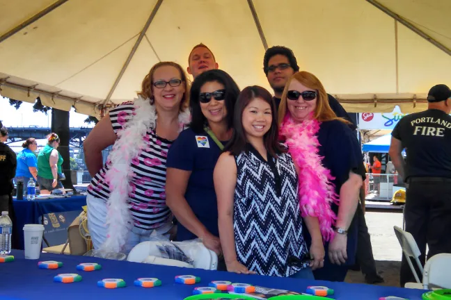 DCJ staff in the public safety booth at the Portland PRIDE festival