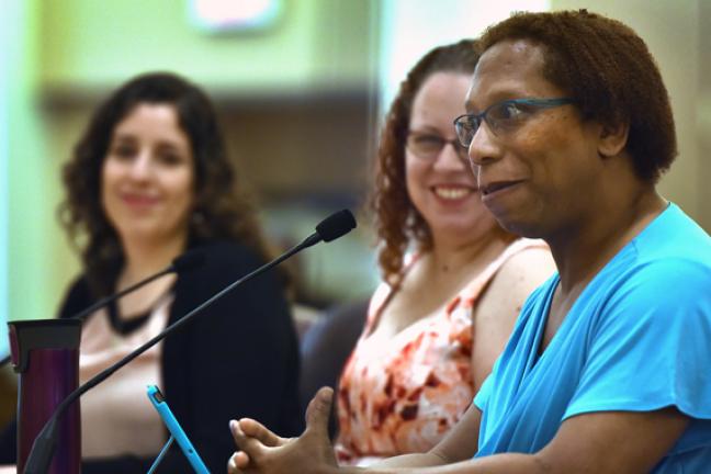 Adrienne Kincaide (right) and her wife Jamie (center) at Thursday's proclamation.