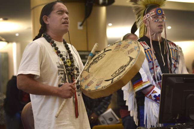 Fish Martinez performs a hand drum song in honor of Indigenous People’s Day at Thursday’s board meeting. 