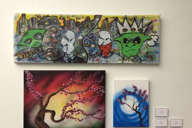 Three art pieces featured in the DCJ client art show.
