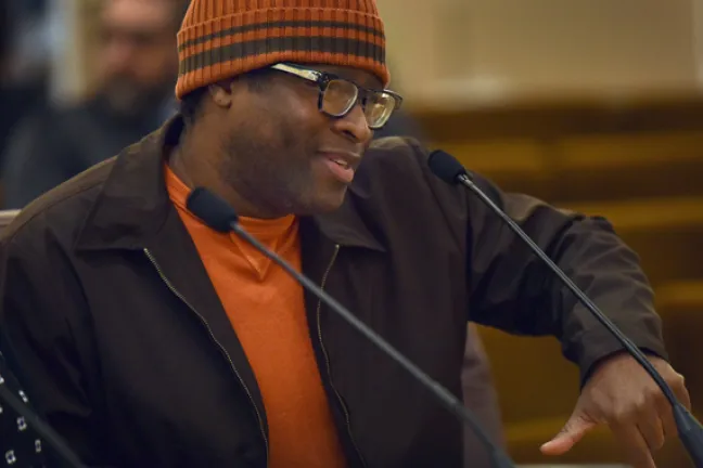 Free Geek volunteer Charles Dory addresses the Board of Commissioner on Thursday.
