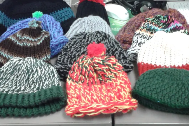 Hats and scarves knitted by A&E participants 
