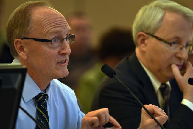 Owner representative Mike Day (left) addresses the board at Tuesday's briefing.