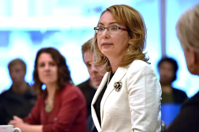 Gabrielle Giffords addresses panel members at Friday's event.