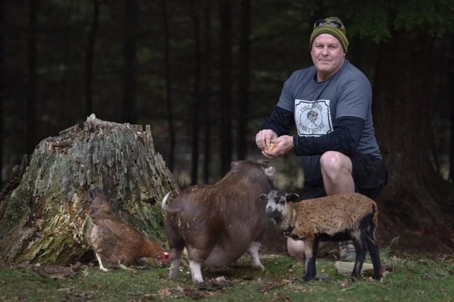 Josh Smith, Cofounder of Odd Man Inn with his wife Wendy, adopted Pig Newton from the Multnomah County Animal Shelter