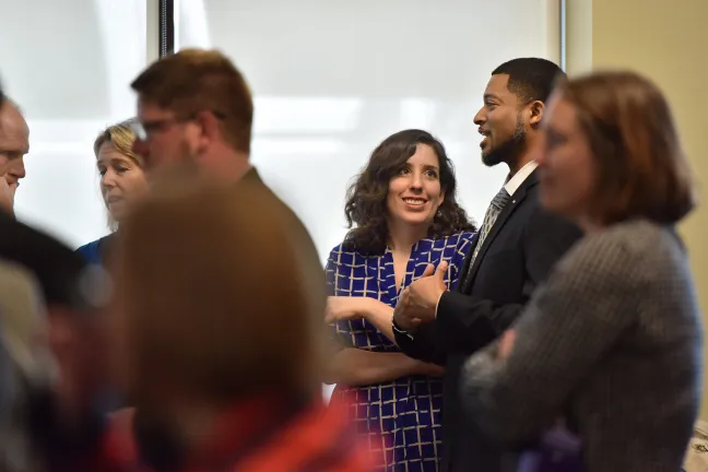 Chief Operating Officer Marissa Madrigal chats with Housing Stability Council member Aubre Dickson