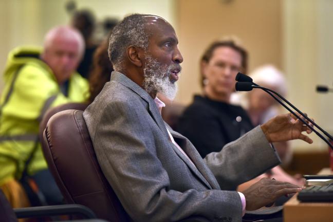 Law professor at the University of California Berkeley  john a. powell addresses the board on Thursday.