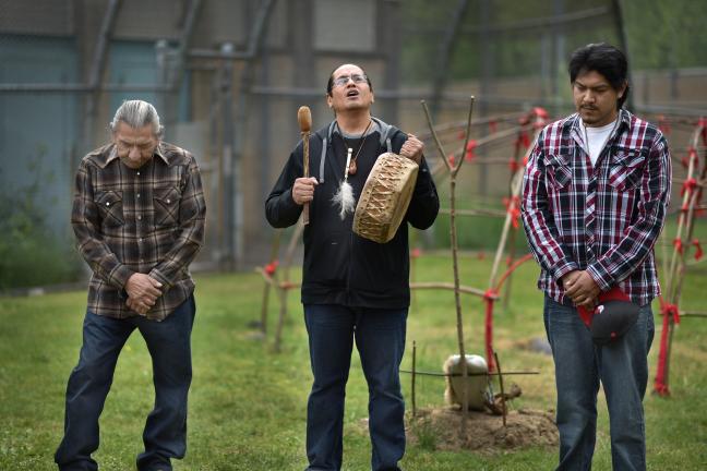 Sundance Chief John Bravehawk, Latino Network care manager and singer Rodolfo Serna and firekeeper Gerardo Calixto-Cara take part in blessing ceremony for new sweat lodge.