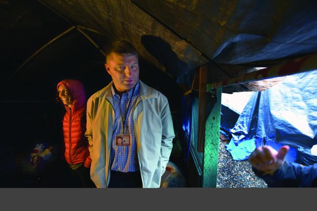 Epidemiologist Amy Zlot and Health Inspector Mike Christman inspect a homeless shelter in downtown Portland. 