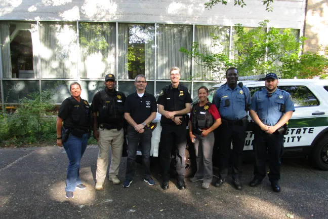 Parole/Probation Officers pose with public safety partners at the Park Blocks National Night Out event