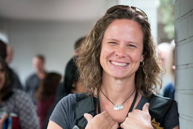 Parole & Probation Officer Barbara Fletcher smiles for camera at ribbon cutting