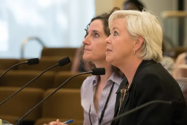 Environmental Health Director Jae Douglas (right) and Deputy Health Director Dr. Jennifer Vines brief the Board of Commissioners Tuesday on teen smoking rates.