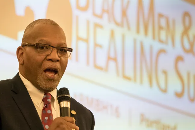 Portland Police Captain Kevin Modica performs Master of Ceremony duties for first Black Men and Boys Healing Conference