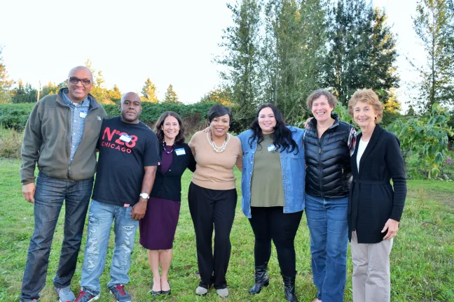 DCJ staff, County Commissioners pose with program participants and partners.