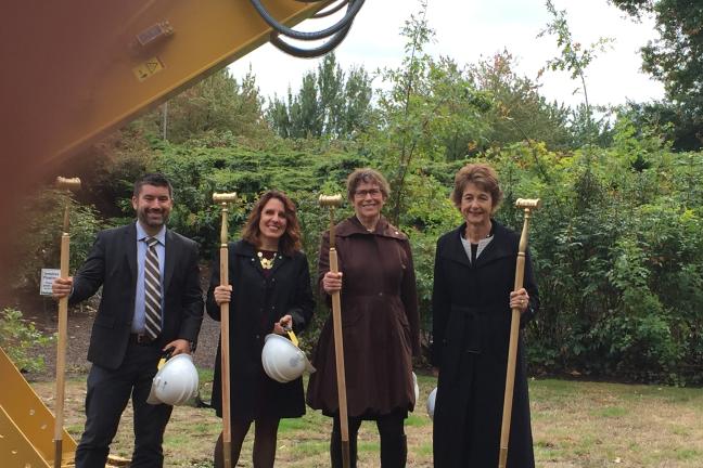 Multnomah County Commissioners pose with smiles and shovels