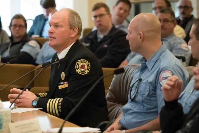 Ken Burns, left, of Portland Fire Bureau testifies before the Board.