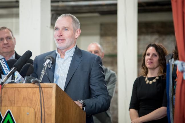 Developer Tom Cody decribes his decision to offer space for a temporary shelter as Dave Chown, left, and Chair Kafoury right, look on.