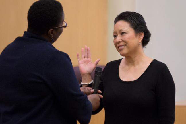 Commissioner Lori Stegmann, representing District 4 gets sworn-in by the honorable Judge Adrienne Nelson at Tuesday's ceremony.