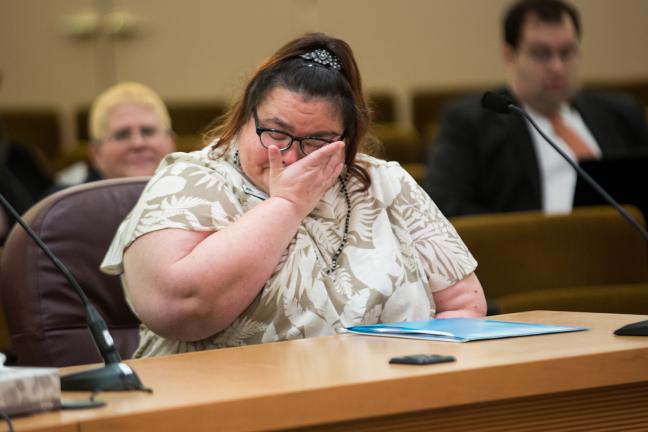 Domestic violence survivor Wendy Shumway shares her emotional story at Thursday's meeting.