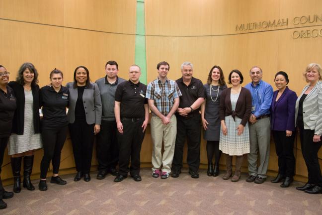 Embassy Suites interns, Albertina Kerr staff, Department of County Human Services staff and the Multnomah County Board of Commissioners pose for a group photo in celebration of Intellectual and Developmental Disabilities Awareness Month.