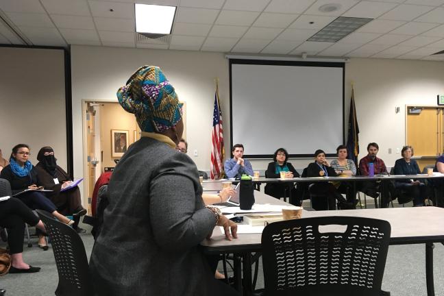 Debbie Clavon, front left, speaks during the East County Caring Community's March 2, 2017, meeting.