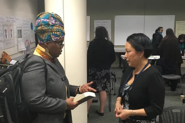 Debbie Clavon, left, talks with Multnomah County Commissioner Lori Stegmann after the East County Caring Community meeting March 2.