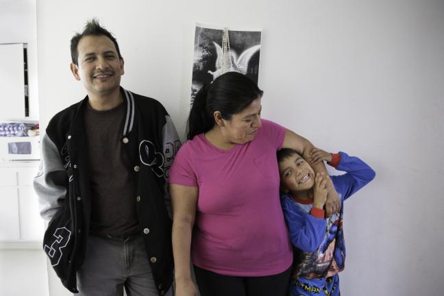 Adelfa and her husband Jorge, with one of their three children.