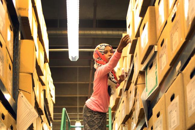 SummerWorks intern Ayan Ahmed, a then-junior at David Douglas High School, labels boxes at Multnomah County Archives during her 2015 summer internship.