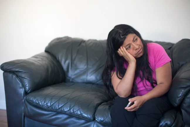 Adelfa settles her hildrne into their new apartment, but worries whether they'll be pushed out again.