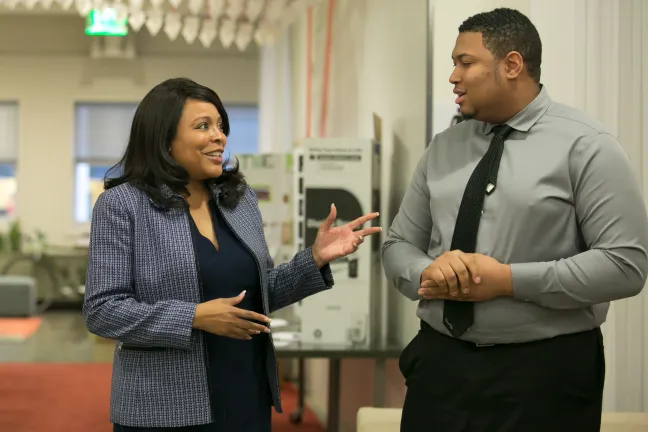 Commissioner Loretta Smith talks with intern Zuriel Hammond during a celebration of SummerWorks.