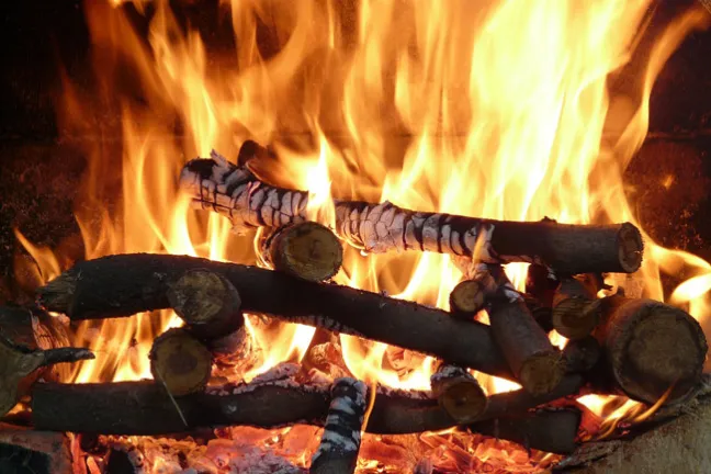 blazing fireplace logs