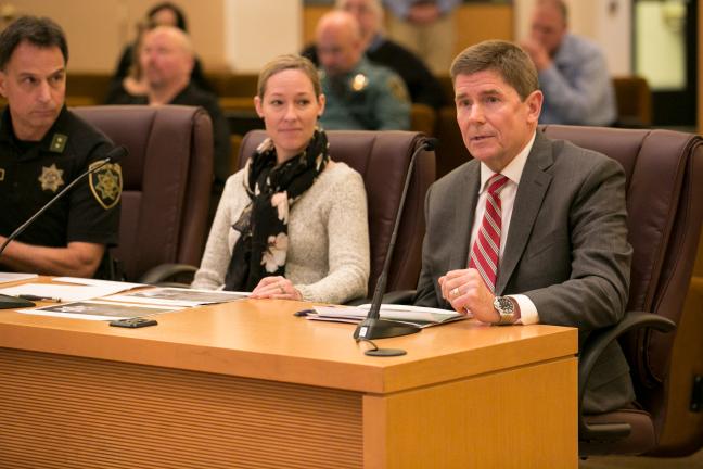 (far right) Dr. Michael Seale, (far right) Corrections Health Medical Director. speaks before board.