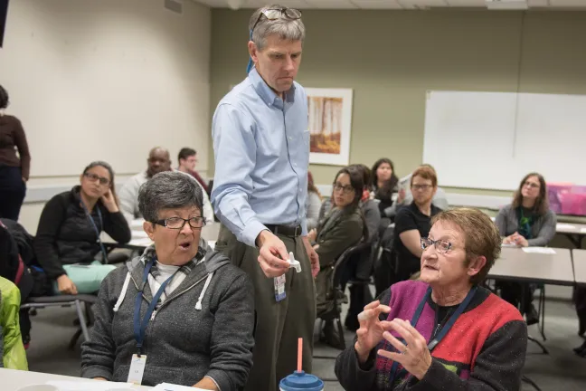Dr. Paul Lewis passes around a sample bottle of Naloxone, the drug that can reverse an opioid overdose.