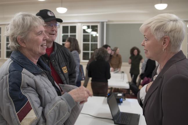 Environmental Health Director Jae Douglas talks to Corbett couple Malcolm and Kathie Freund.