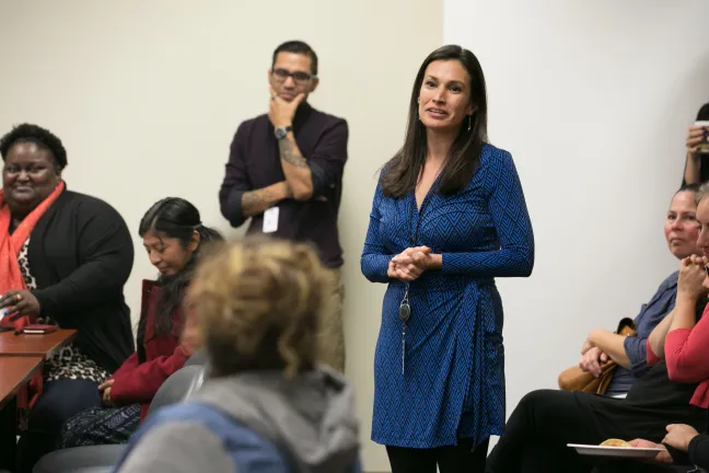 El Programa Hispano Executive Director Patricia Rojas made introductions at Monday's event.