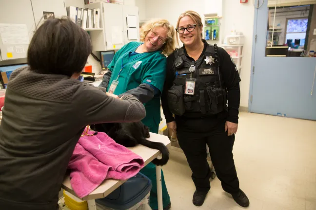 Veterinarian Technician Roberta L Ruble & Field Services Officer Taffy Burrell pose for picture