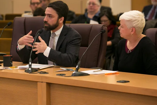 John Wasiutynski, director of the Office of Sustainability and Dr. Jae Douglas, director of environmental health services in Multnomah County speak before board at Dec 21 meeting